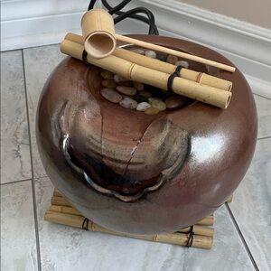 Desktop zen fountain with bamboo and river rocks